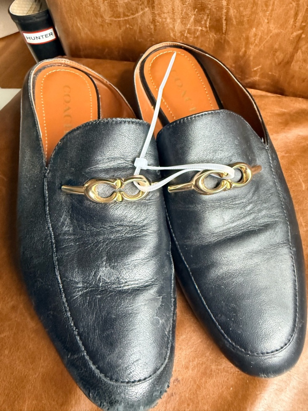 Coach Black Leather women’s Slip-On Loafers with Gold Bit